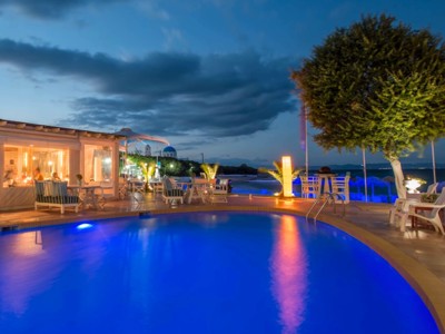 Pool by night at Oasis Beach Hotel Spa