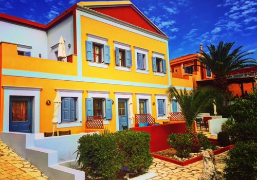 Facade of Taxiarchis Apartments in Symi