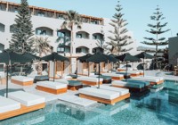 Sun Loungers By Pool At Eliros Mare Beachfront Poem Hotel